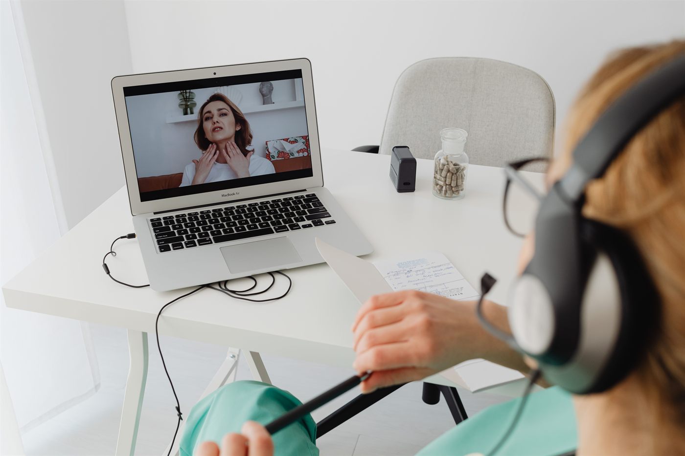 A clinician on a video consultation