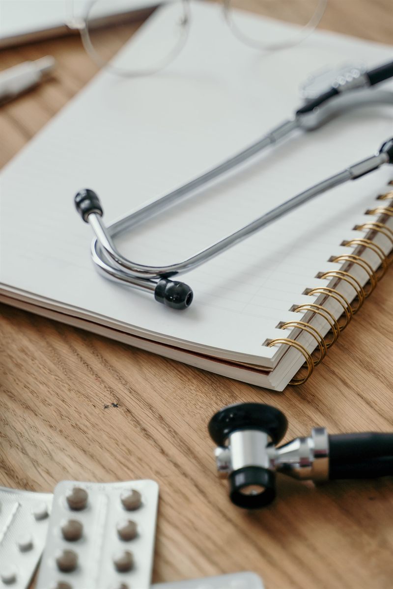 A stethoscope resting on an open notebook