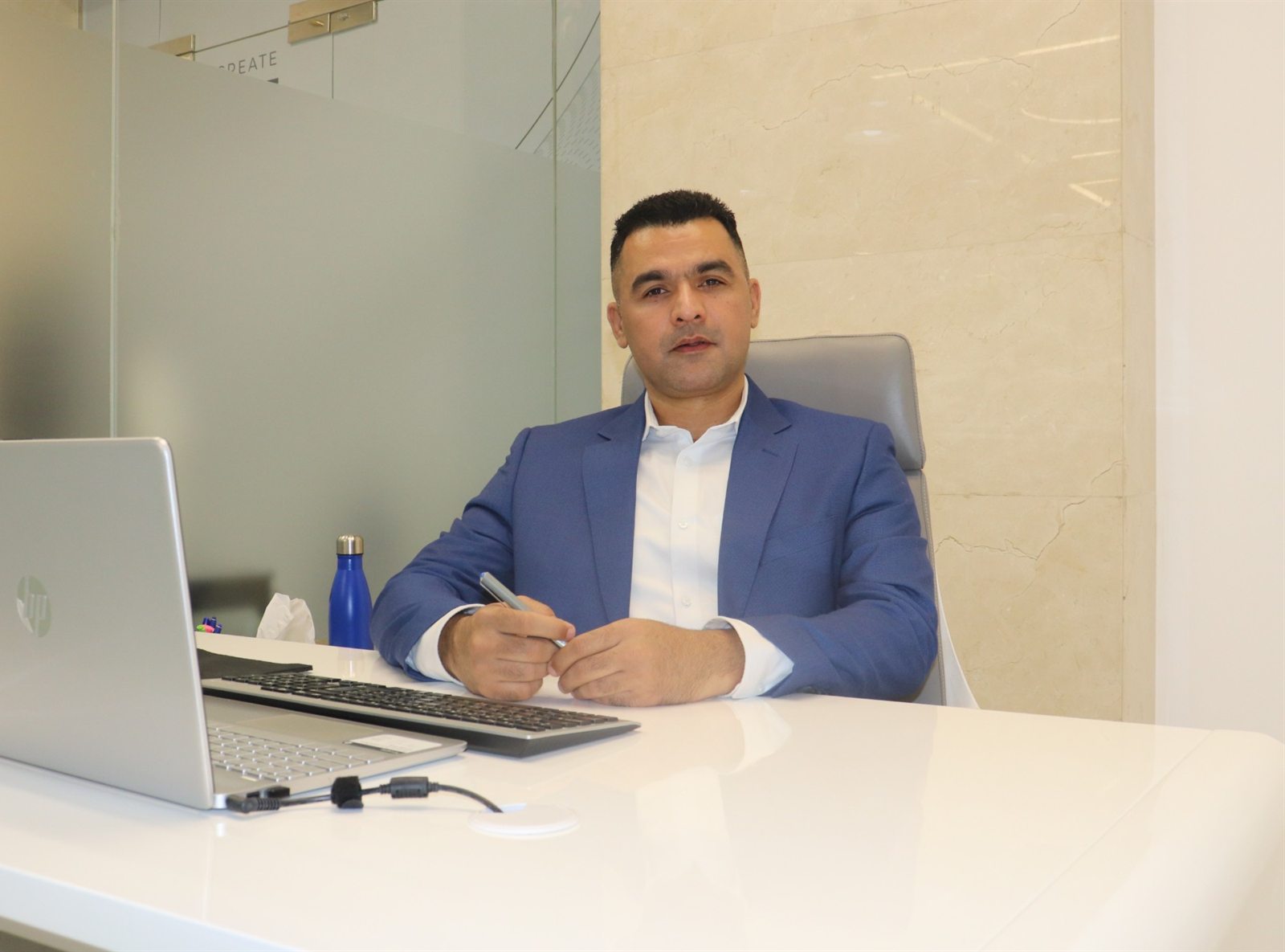 Saif Shah, Founder and Managing Director, at his desk
